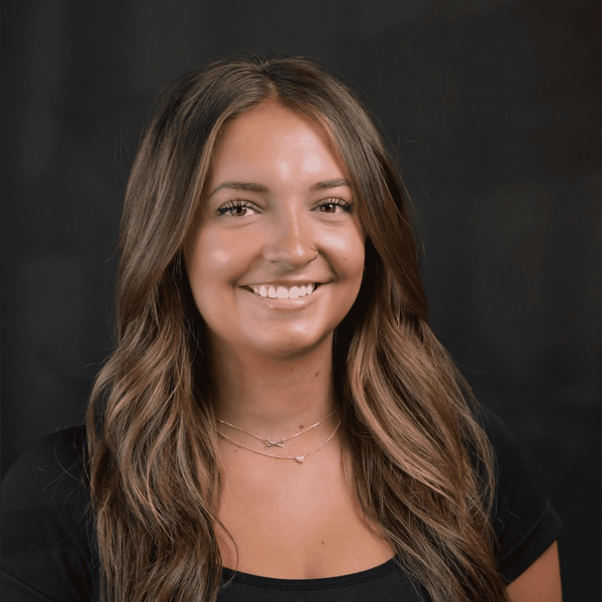 Portrait of Makayla, a professional stylist at Chad + Co., showcasing their expertise and style.