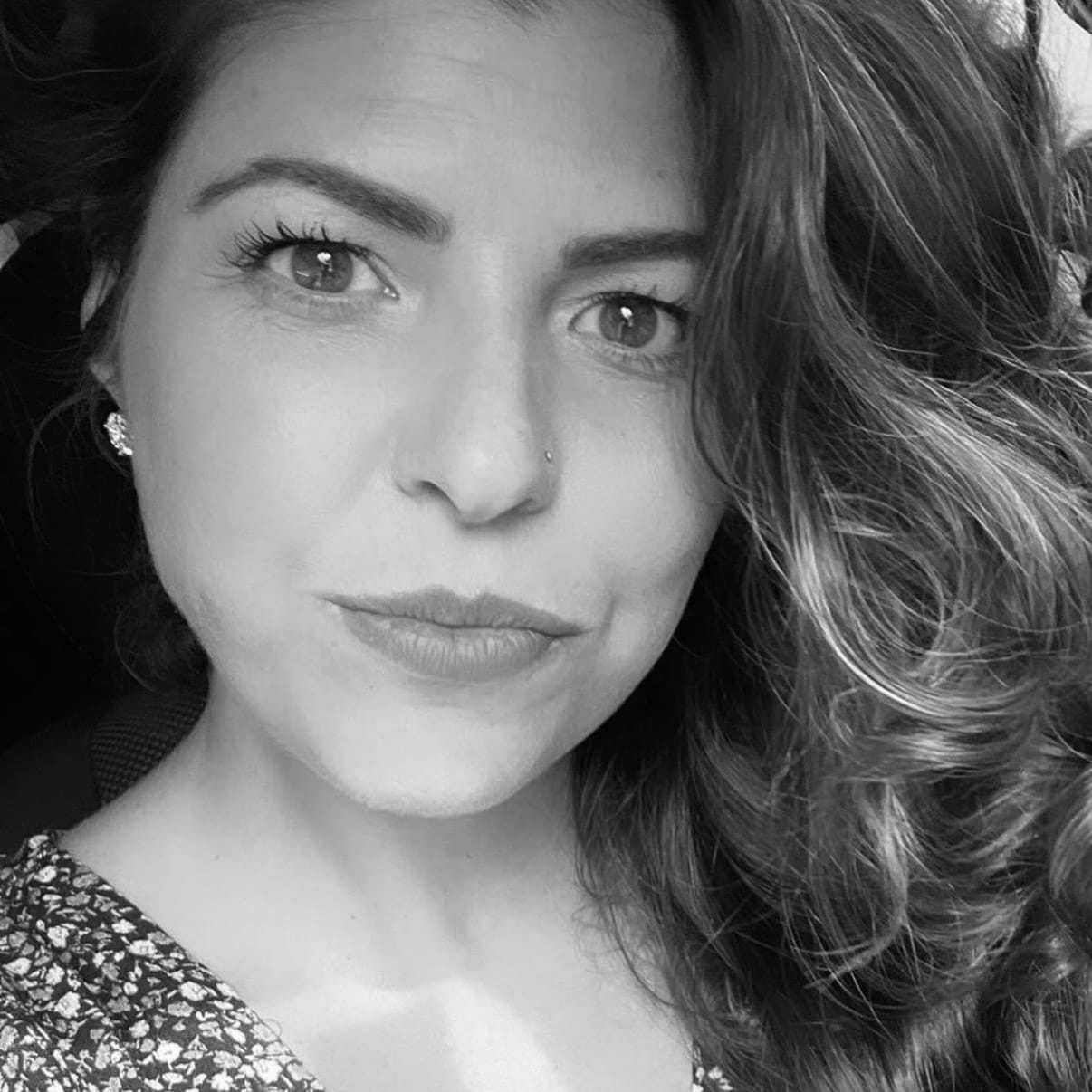 Portrait of Jessica Hicks, a professional stylist at The Robert Andrew Salon & Spa Collection, showcasing their expertise and style.