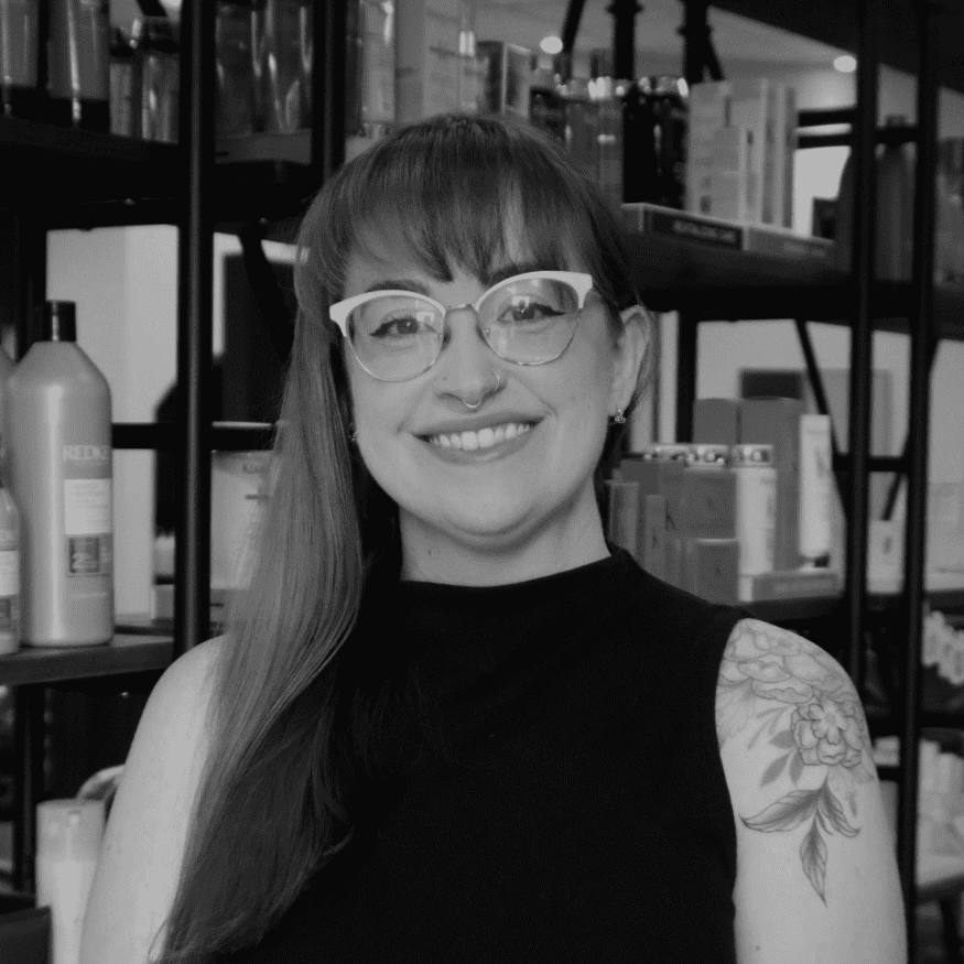 Portrait of Rebecca Tope, a professional stylist at Yacht Club Salon, showcasing their expertise and style.