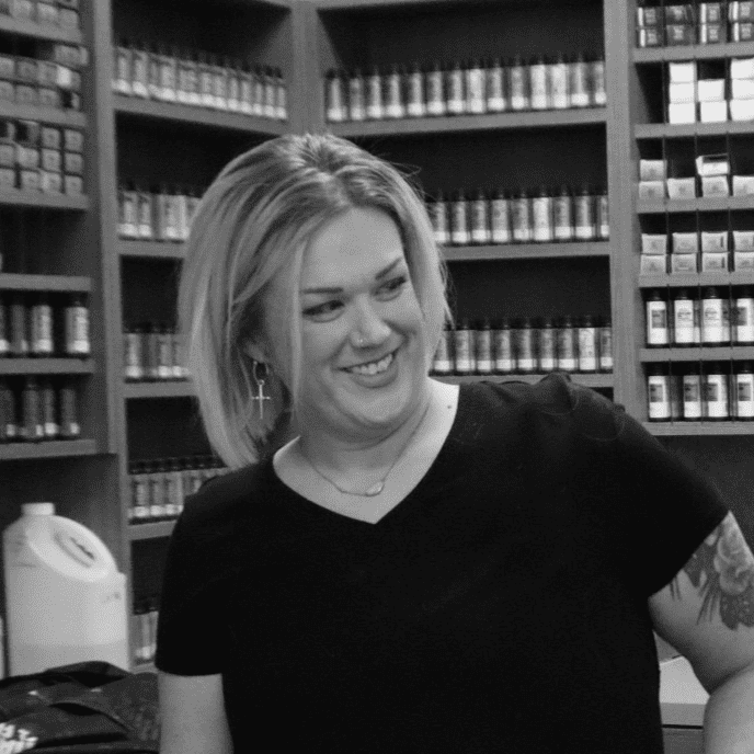 Portrait of Erin Frost, a professional stylist at Yacht Club Salon, showcasing their expertise and style.