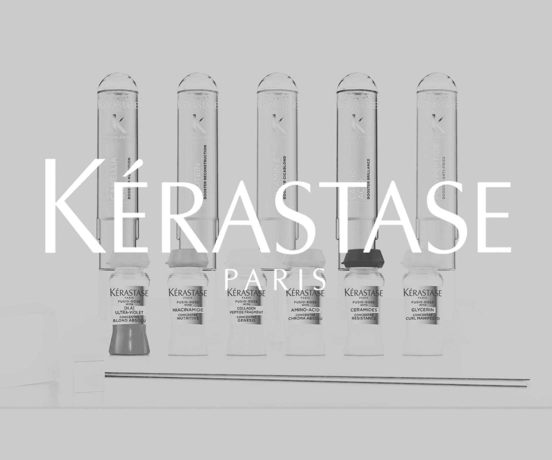 Kérastase Paris hair care containers displayed in a row with logo overlay.