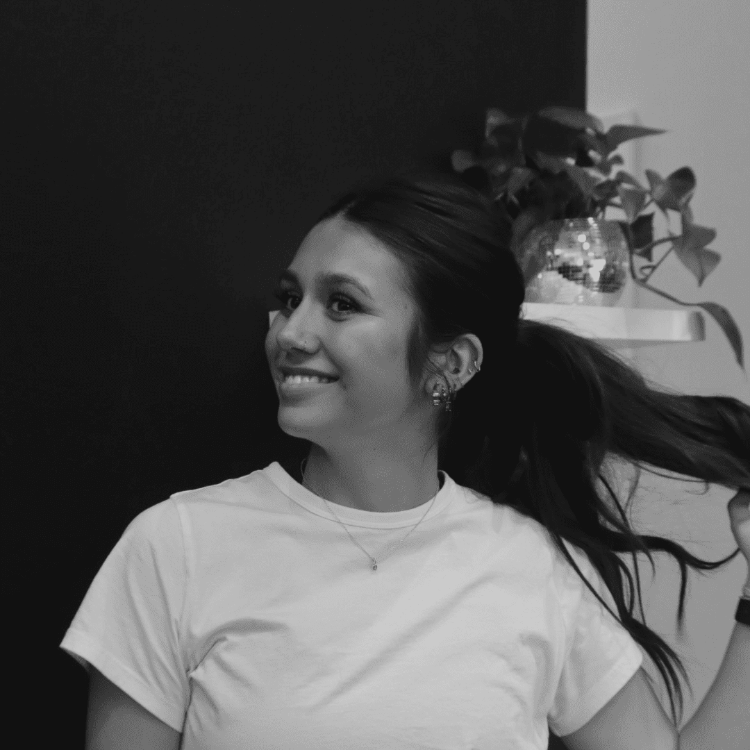 Portrait of Ali Guerrero, a professional stylist at Yacht Club Salon, showcasing their expertise and style.
